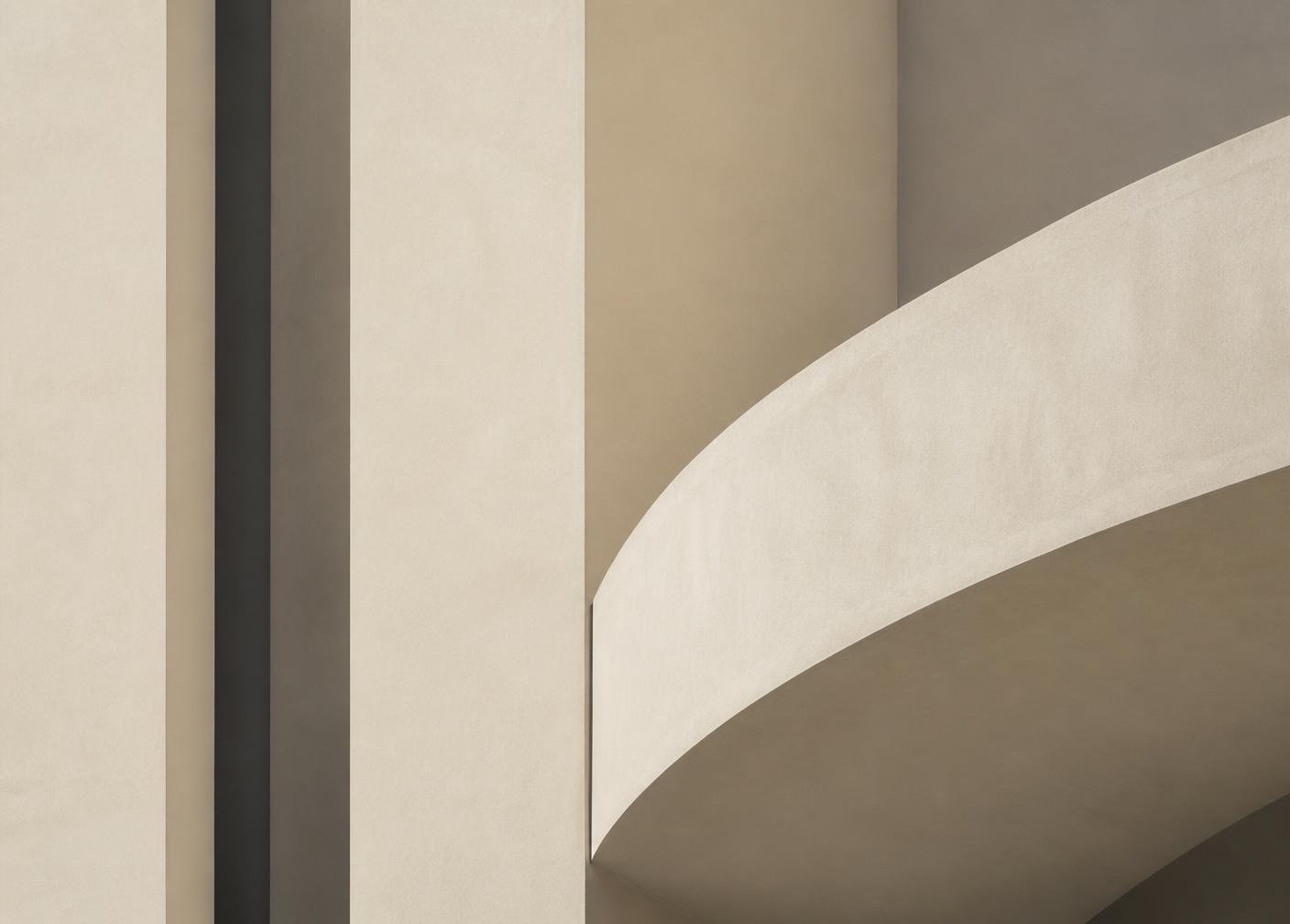 Minimal architectural composition of curved and vertical forms in warm neutral tones